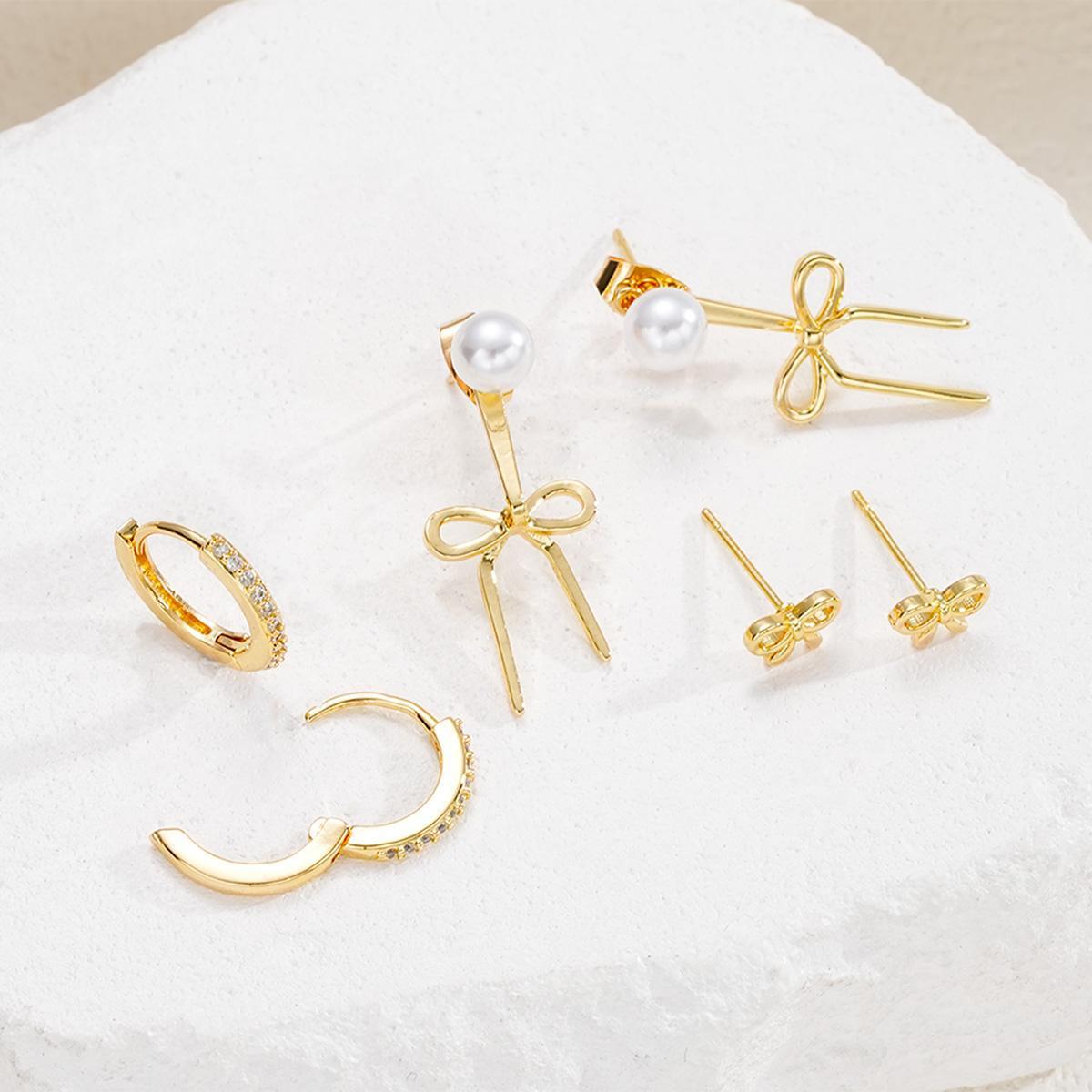 Damen Ohrstecker-Set mit funkelnden Schmuckelementen und eleganten Schleifen Shop Nory