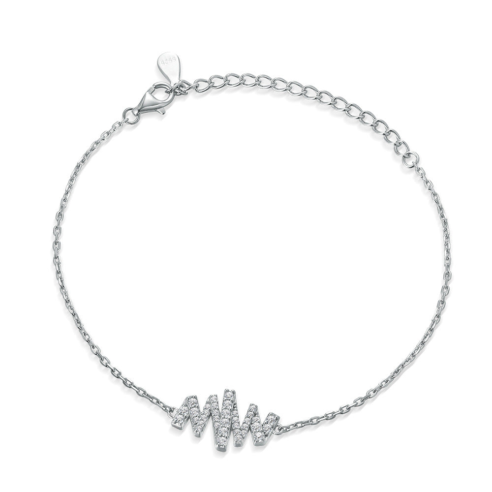 Damenarmband mit funkelndem Zirkonia und modernem Wellenmuster Shop Nory