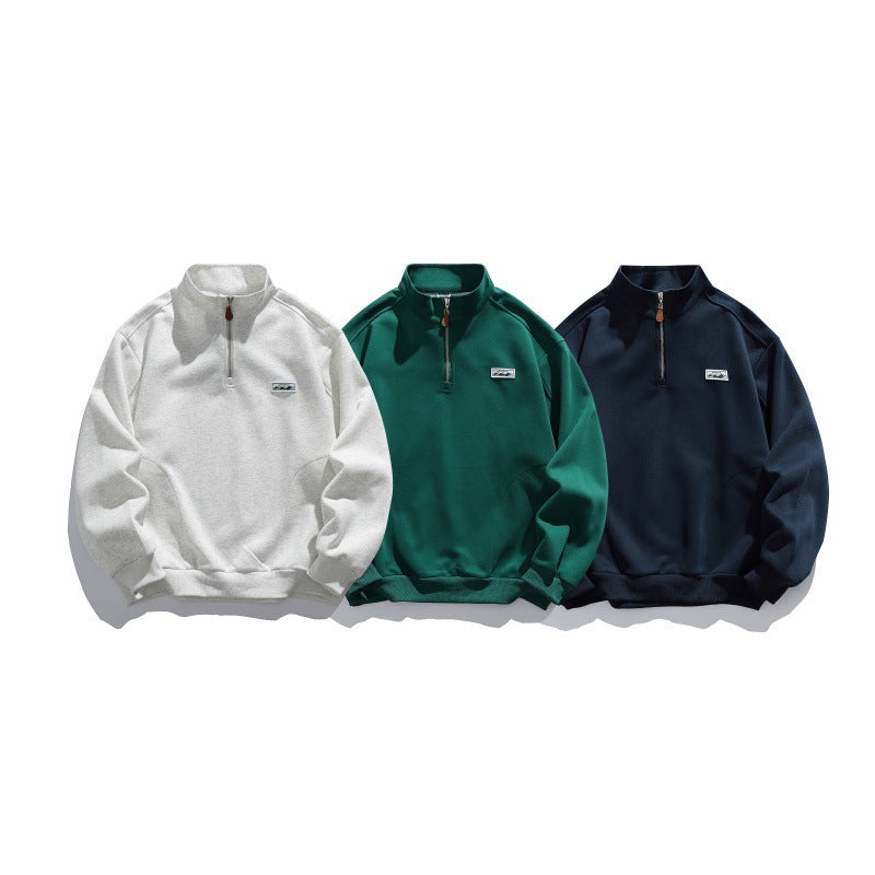 Unisex Halbzip-Sweatshirt mit Stehkragen, Raglanärmeln und minimalistischer Brustpatch Shop Nory