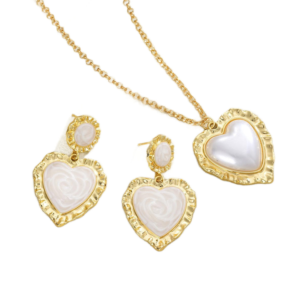 Damen Schmuckset mit herzförmigen Anhängern und eleganten Goldakzenten Shop Nory
