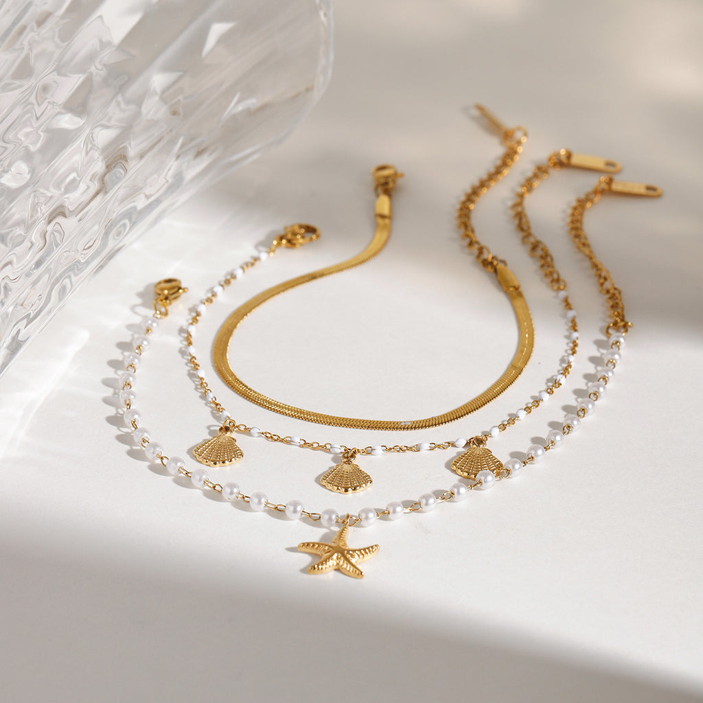 Damen Armband mit Muschel- und Sternenmotiven aus hypoallergenem Edelstahl Shop Nory