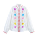 Damen Bluse mit bunten Stickereien und romantischem Rüschendesign