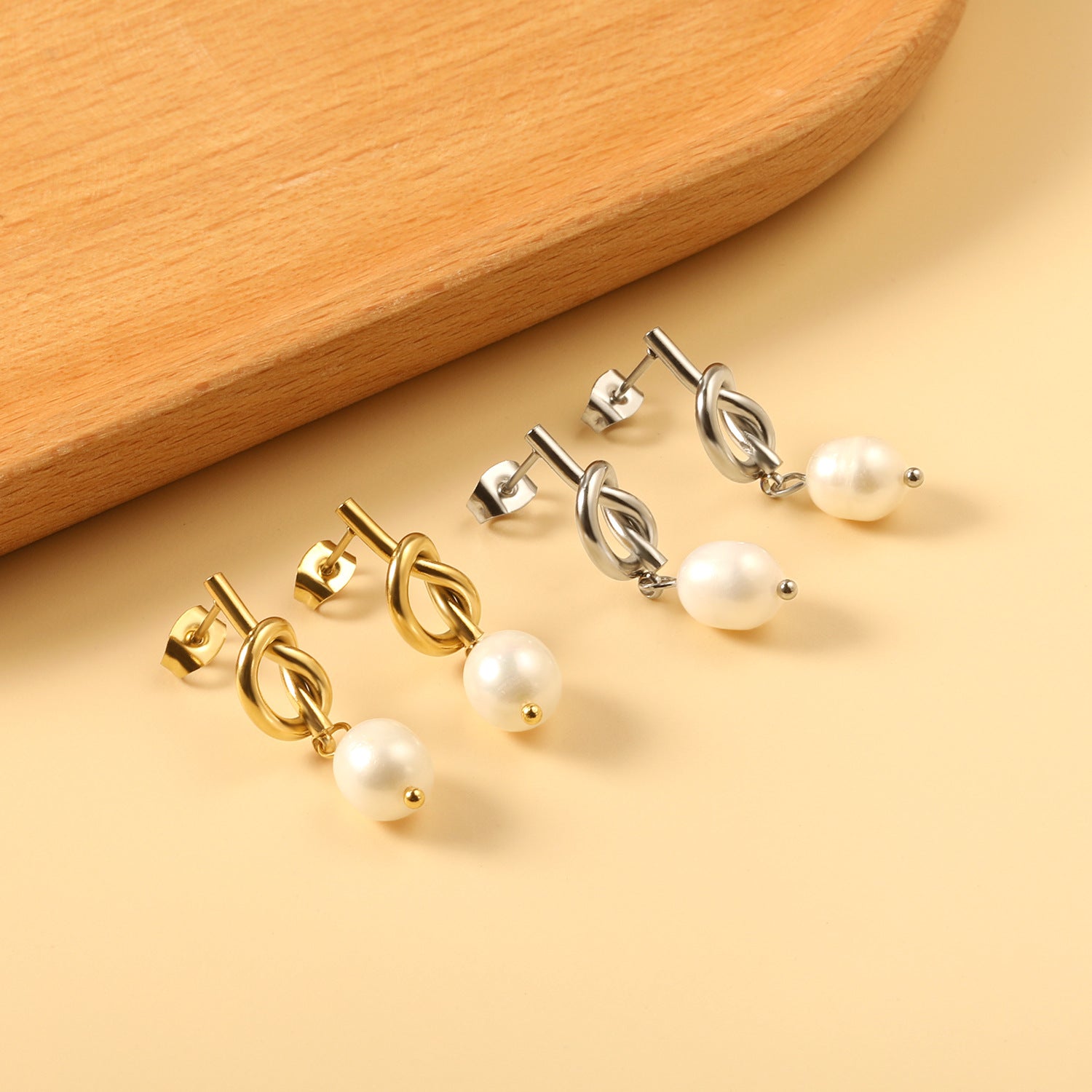 Damen Ohrhänger mit elegantem Knotendesign und Perlen aus hochwertigem Edelstahl Shop Nory