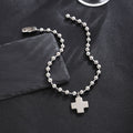 Damenarmband mit Kreuzanhänger und glänzenden Perlen Shop Nory