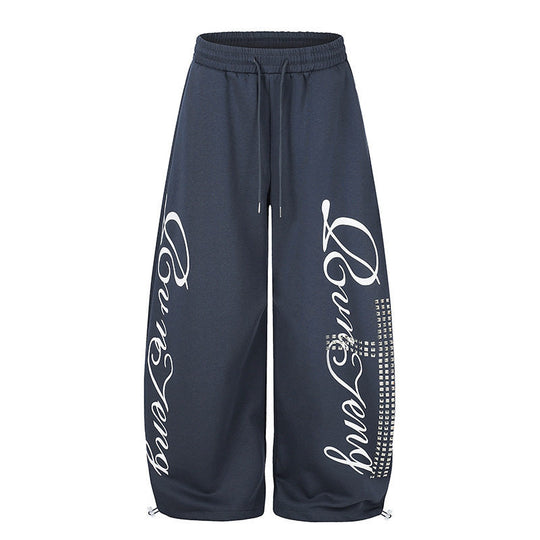 Damen Palazzo-Sweatpants im Culotte-Stil mit hohem Bund, Tunnelzug, Schriftprint und Strassbesatz Shop Nory