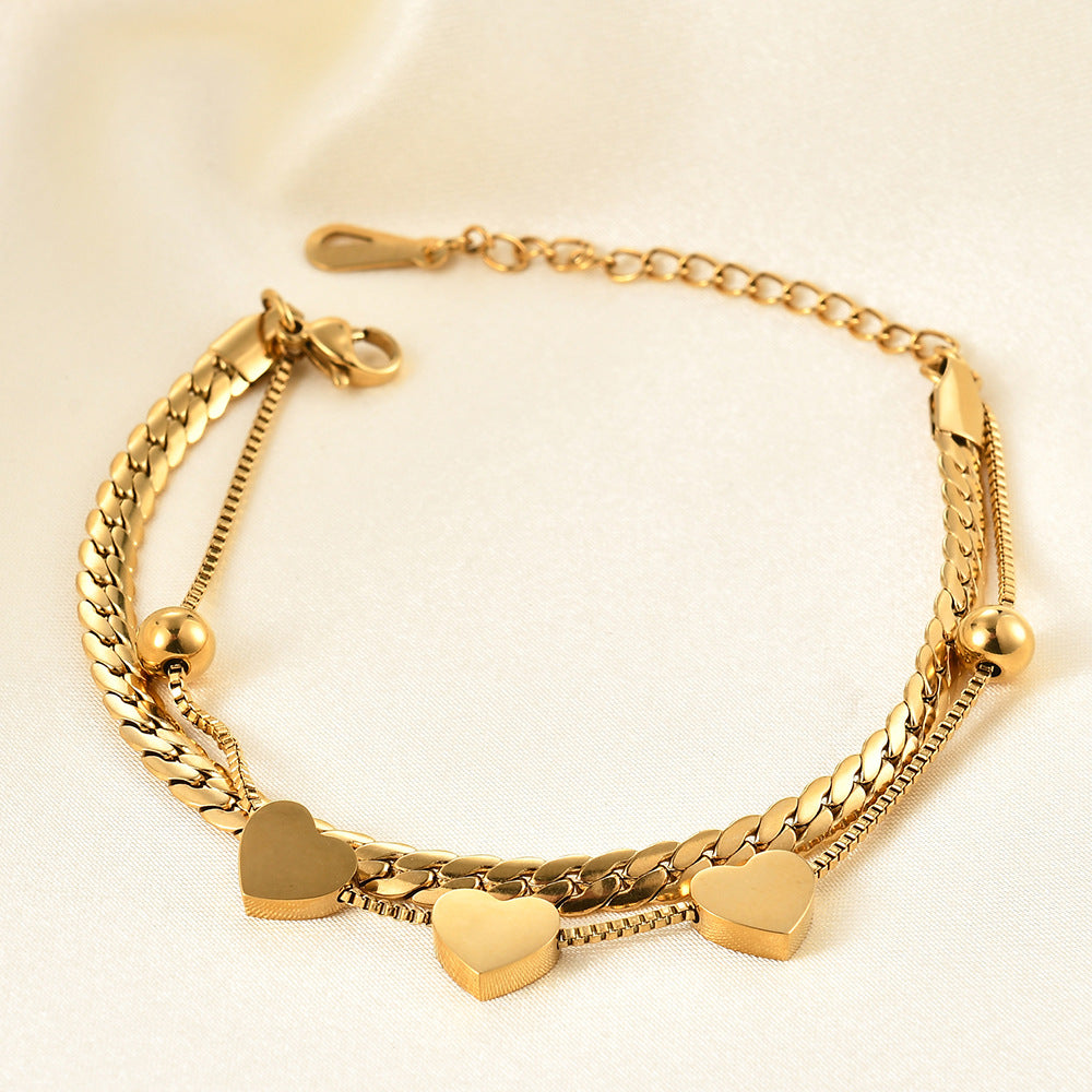 Damen Armband mit elegantem Herzdesign und feinen Kettengliedern Shop Nory