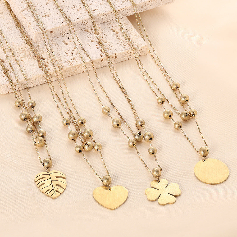 Damen Halskette mit herzförmigem Anhänger und eleganten Perlen Shop Nory