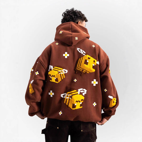 Unisex nan Kapuzenpullover mit eingestricktem Pixel-Bienenmotiv und aufgesetzter Kängurutasche