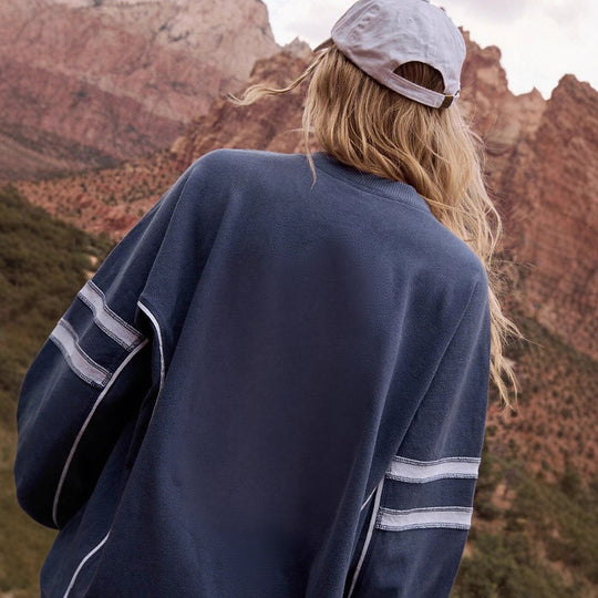 Damen Oversize-Sweatshirt im College‑Look mit breitem Kontrastpaneel und sportiven Ärmelstreifen Shop Nory