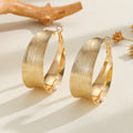 Damen Creolen im eleganten und geschwungenen Design Shop Nory