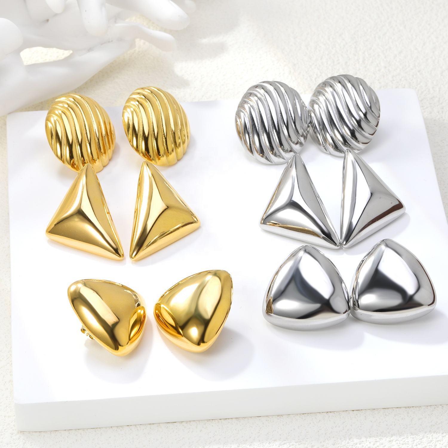 Damen moderne geschwungene Edelstahl-Ohrstecker Shop Nory