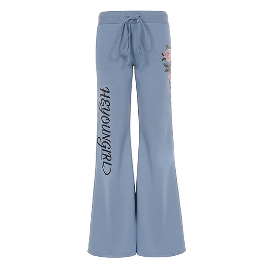 Damen nan ausgestellte Jersey-Sweathose mit Kordelzug, floralem Seitenprint und Statement-Schriftzug Shop Nory