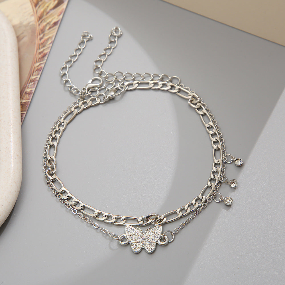 Damen Fußkettchen mit funkelnden Ornamenten und floralen Details Shop Nory
