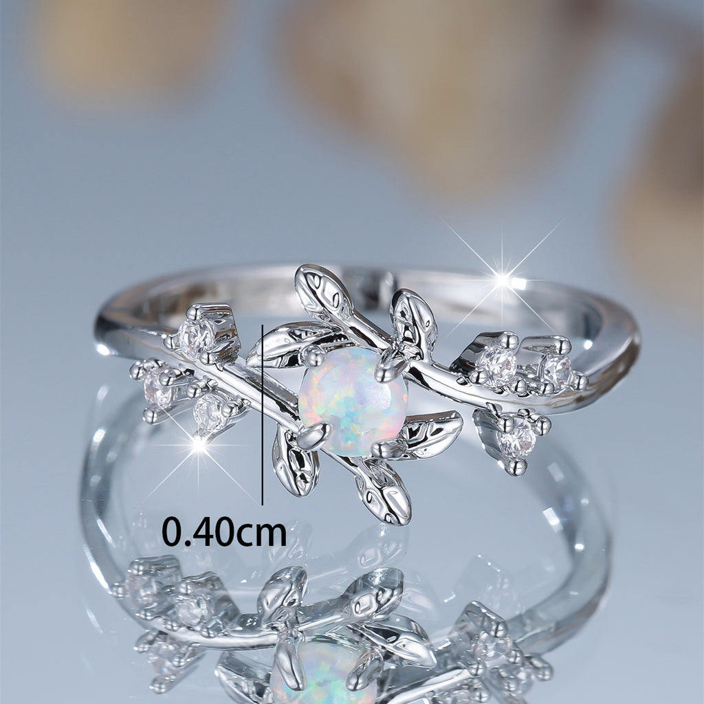 Damen Ring mit kunstvollem Blatt-Design und funkelndem Opal Shop Nory