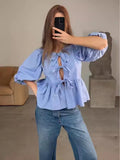 Damen Bluse mit raffinierten Schleifen und voluminösen Ärmeln