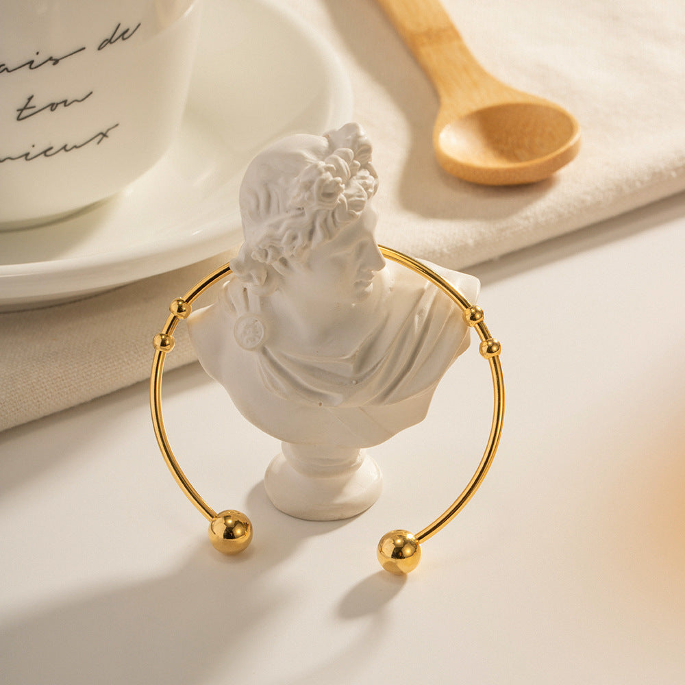 Damen Offenes Armreif mit elegantem Spiral-Design und Goldakzenten Shop Nory
