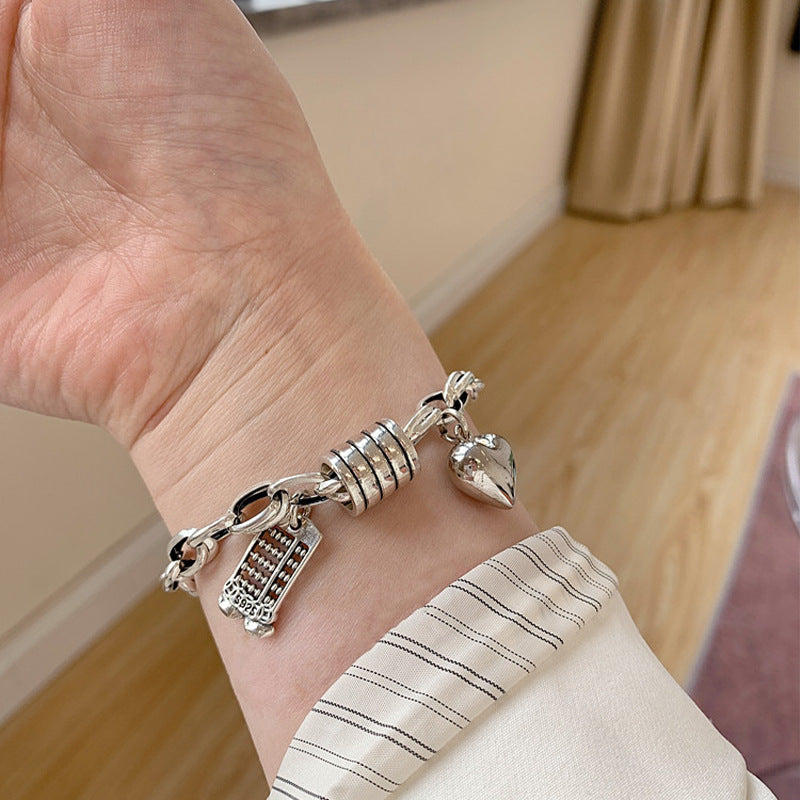 Damenarmband mit charmanten Anhängern Shop Nory