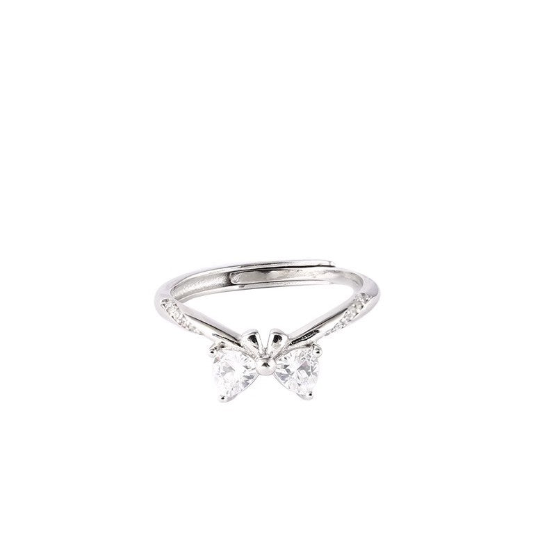 Damen zierlicher Ring mit Schleifenmotiv und funkelnden Akzenten Shop Nory