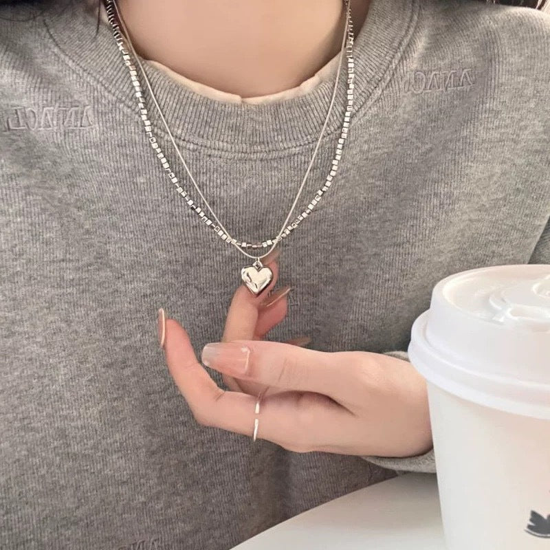 Damen Halskette mit herzförmigem Anhänger und modernem Gliederdesign Shop Nory