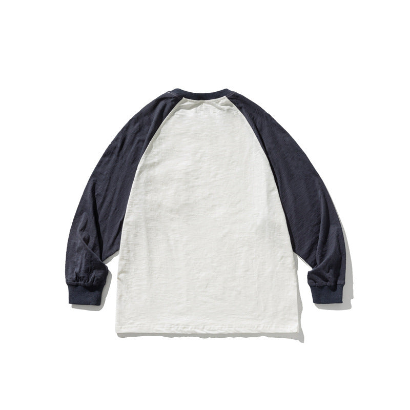 Unisex Lässiges Raglan-Longsleeve mit Kontrastärmeln und aufgesetzter Klappentasche Shop Nory