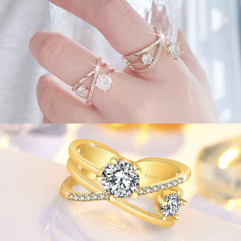 Damen Ring mit funkelnden Zirkonia und elegantem Kreuzdesign Shop Nory