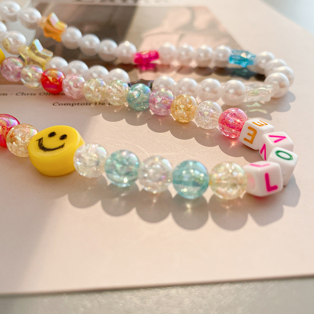 Damen farbenfrohe Schmuck-Halskette mit Smiley und Buchstabenanhängern Shop Nory