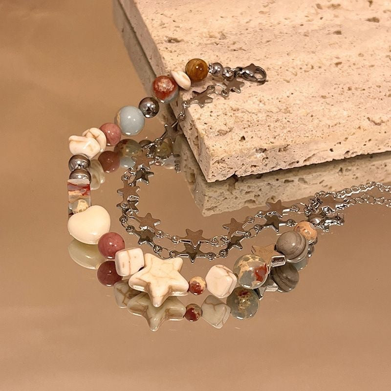 Damen Armband mit bunten Halbedelsteinen und funkelndem Sternenanhänger Shop Nory