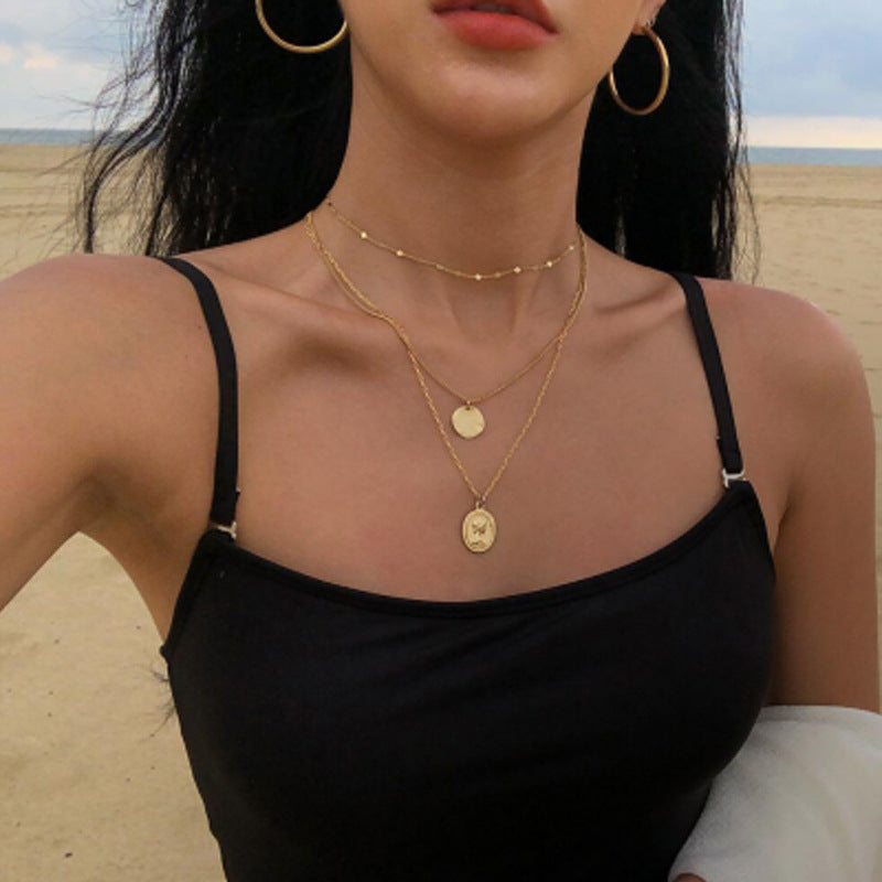 Damen mehrlagige Halskette mit feinen goldenen Kettendesigns und elegante Medaillon-Anhänger Shop Nory