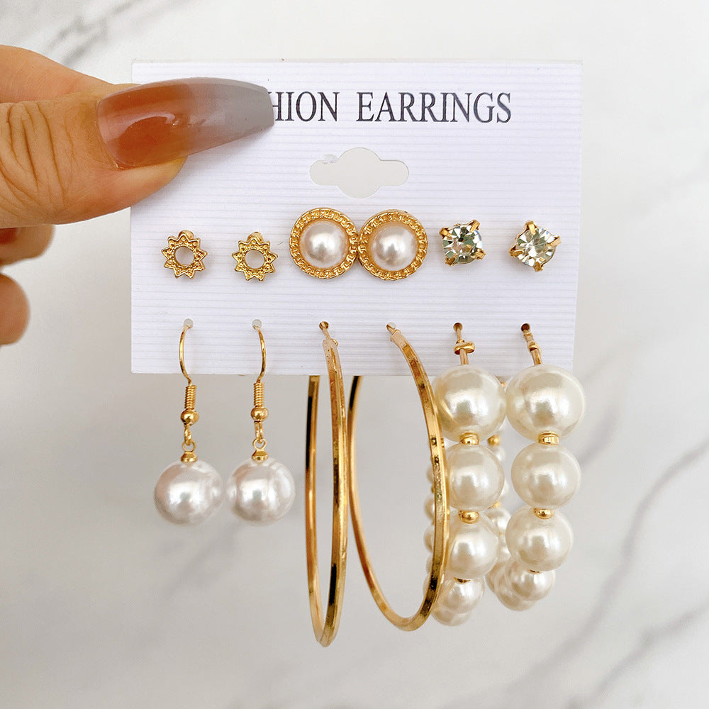 Damen Ohrringe Set mit eleganten herzförmigen Anhängern und funkelnden Kristallen Shop Nory