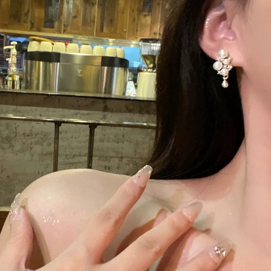 Damen Ohrstecker mit funkelnden Zirkonia und eleganten Perlenakzenten Shop Nory