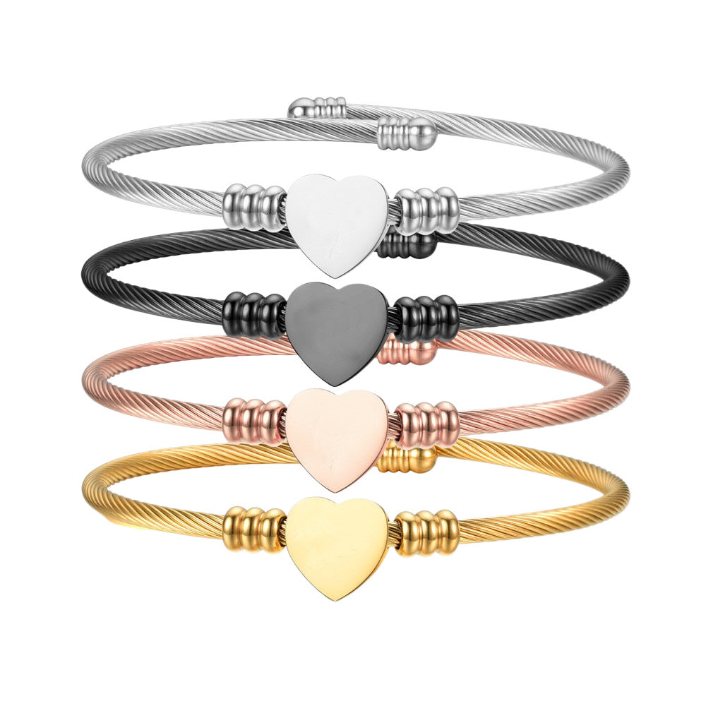 Damen Armreif mit stilvollem Herzanhänger aus hochwertigem Edelstahl Shop Nory