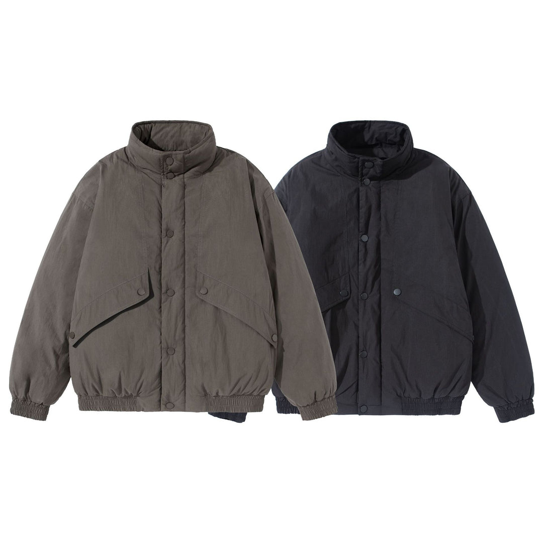 Unisex Kurz geschnittene gesteppte Boxy‑Blousonjacke mit hohem Stehkragen und Utility‑Flaptaschen Shop Nory