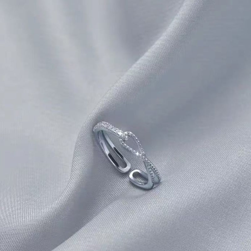 Damen offenes Armband mit zeitgemäßem Wellendesign und funkelndem Zirkonbesatz Shop Nory