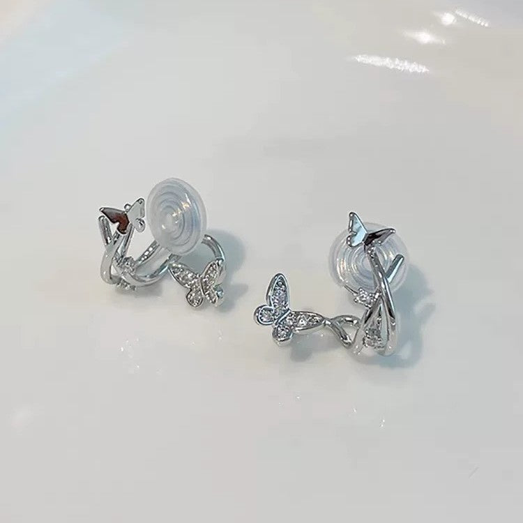 Damen Ohrringe mit glitzernden Schmetterlingen und elegantem Twist-Design Shop Nory