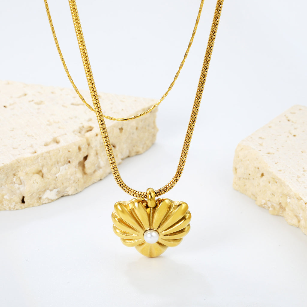 Damen Halskette mit funkelndem Herzanhänger aus goldplattiertem Edelstahl Shop Nory