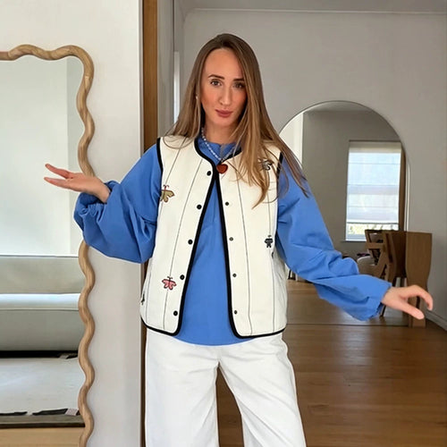 Damen Steppweste mit Stickmotiven, kontrastierter Paspel und Druckknopfverschluss Shop Nory