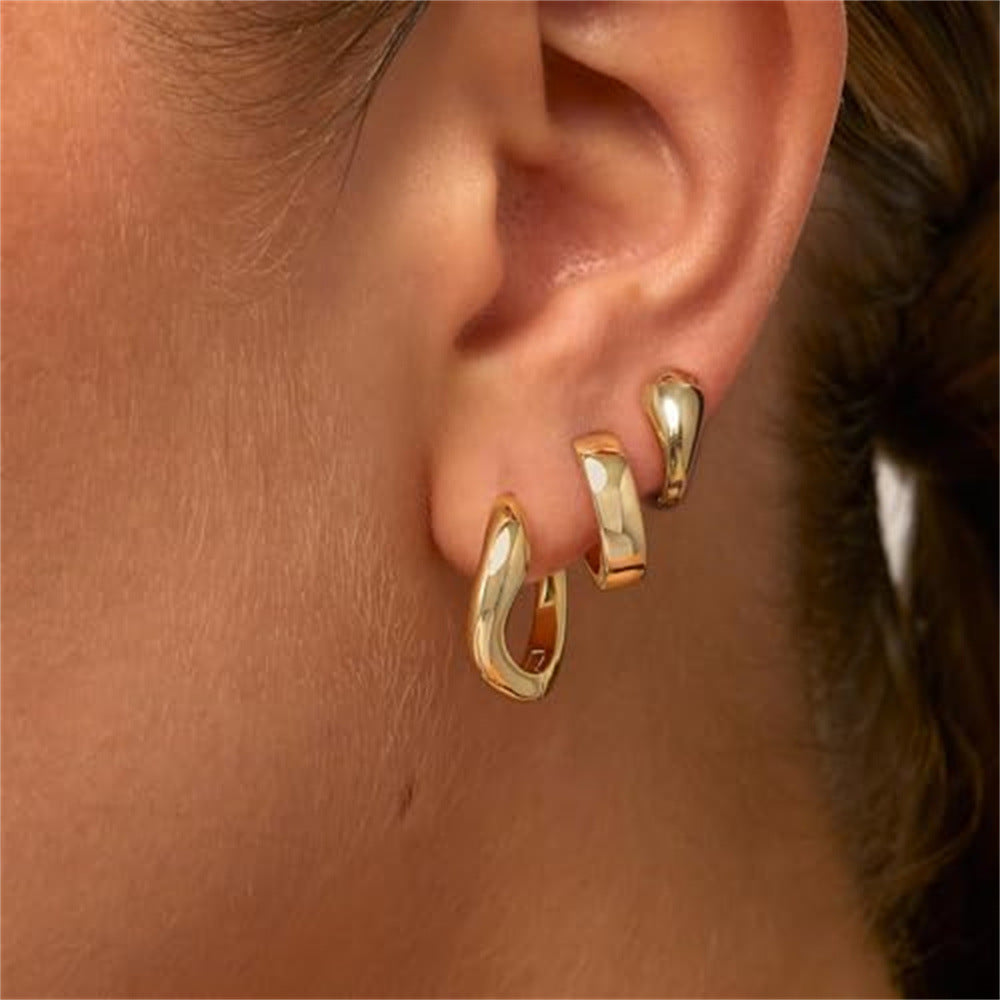 Damen Ohrhänger mit geschwungenem Design und glänzender Oberfläche Shop Nory