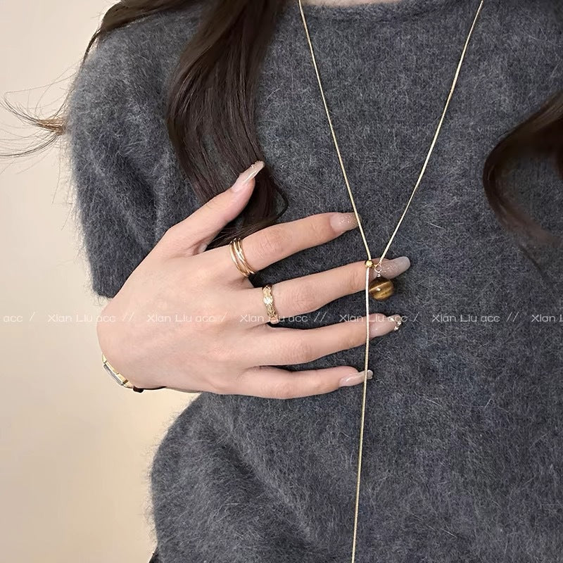 Damen Halskette mit einem einzigartigen Tigeraugen-Anhänger und glänzendem Gold-Design Shop Nory