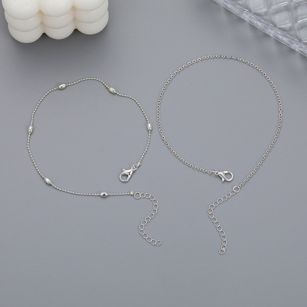 Damen Fußkettchen mit silbernem Herz-Detail und zarten Perlen Shop Nory