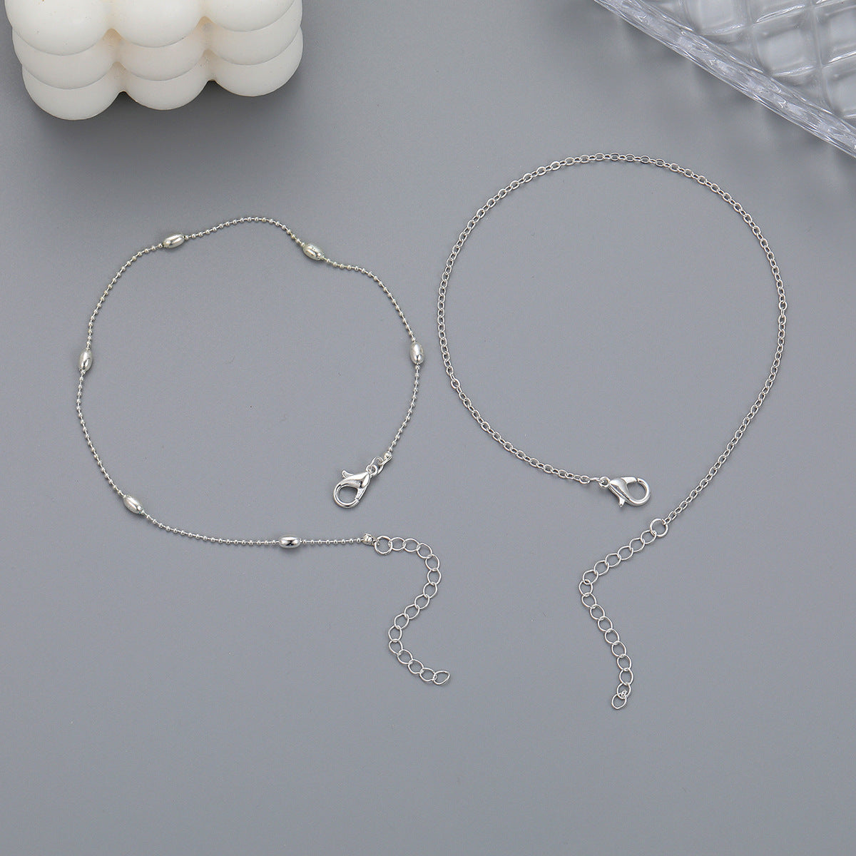 Damen Fußkettchen mit silbernem Herz-Detail und zarten Perlen Shop Nory