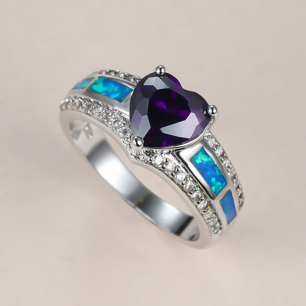 Damen Ring mit herzförmigem smaragdgrünem Stein und feinen Zirkonia-Details Shop Nory