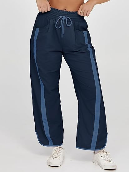 Damen nan relaxte Trackpants mit seitlichem Kontraststreifen, elastischem Smokbund und Eingrifftaschen Shop Nory