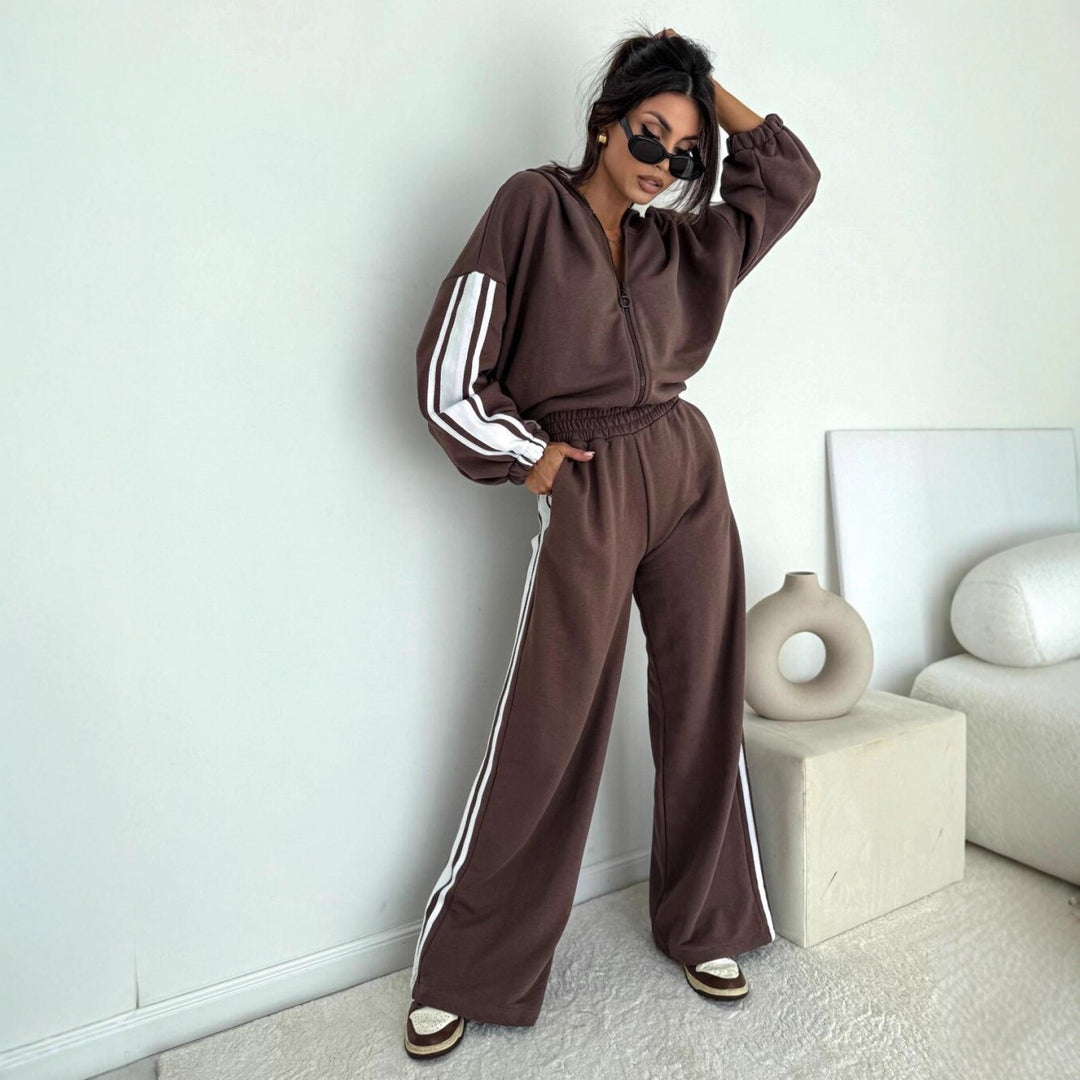 Damen cropped Zip-Hoodie mit voluminösen Ballonärmeln und High-Waist Relaxhose im sportlichen Seitenstreifen-Design Shop Nory