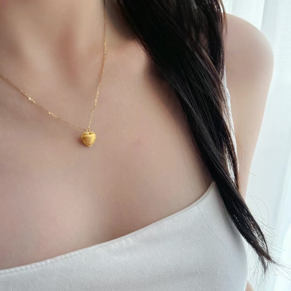 Damen Halskette mit herzförmigem Anhänger aus glänzendem Metall Shop Nory