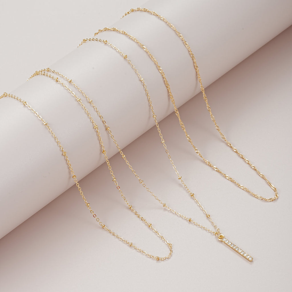 Damen mehrlagige Kette mit funkelndem Anhänger und filigranen Details Shop Nory