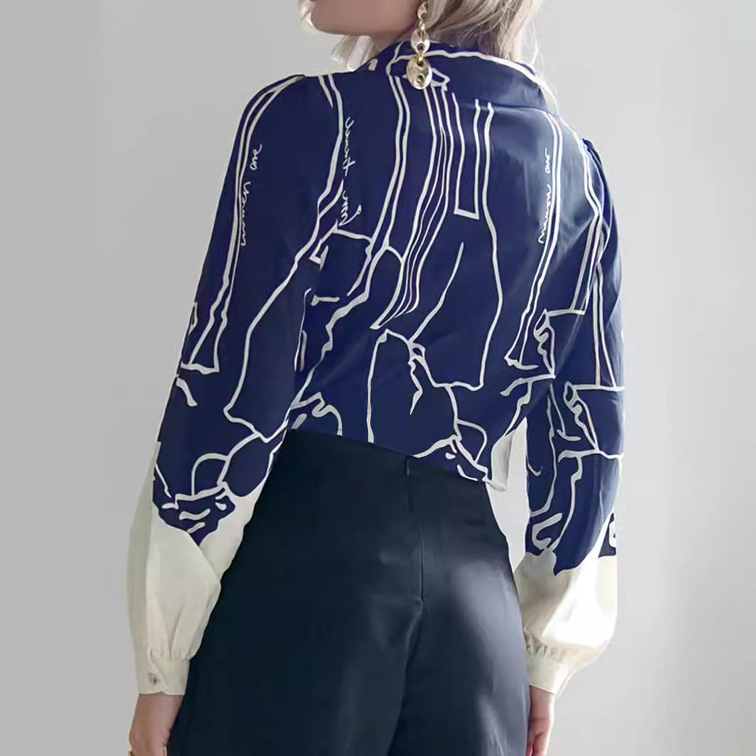 Damen V-Ausschnitt-Bluse mit abstraktem Grafikprint, Ballonärmeln und kontrastierenden Manschetten Shop Nory