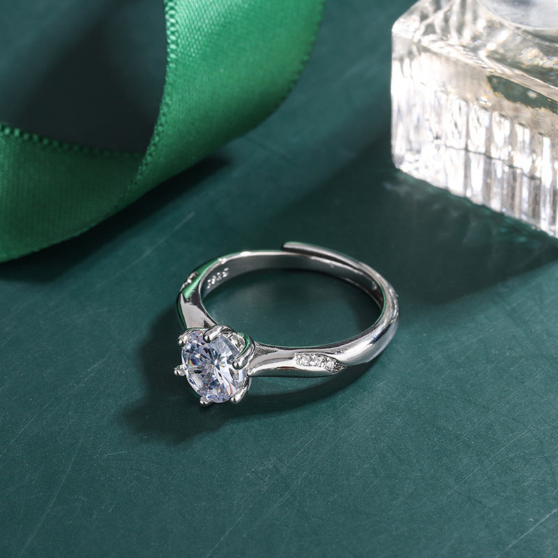 Damenring mit funkelndem Zirkonia-Hauptstein und elegant geschwungenem Design Shop Nory
