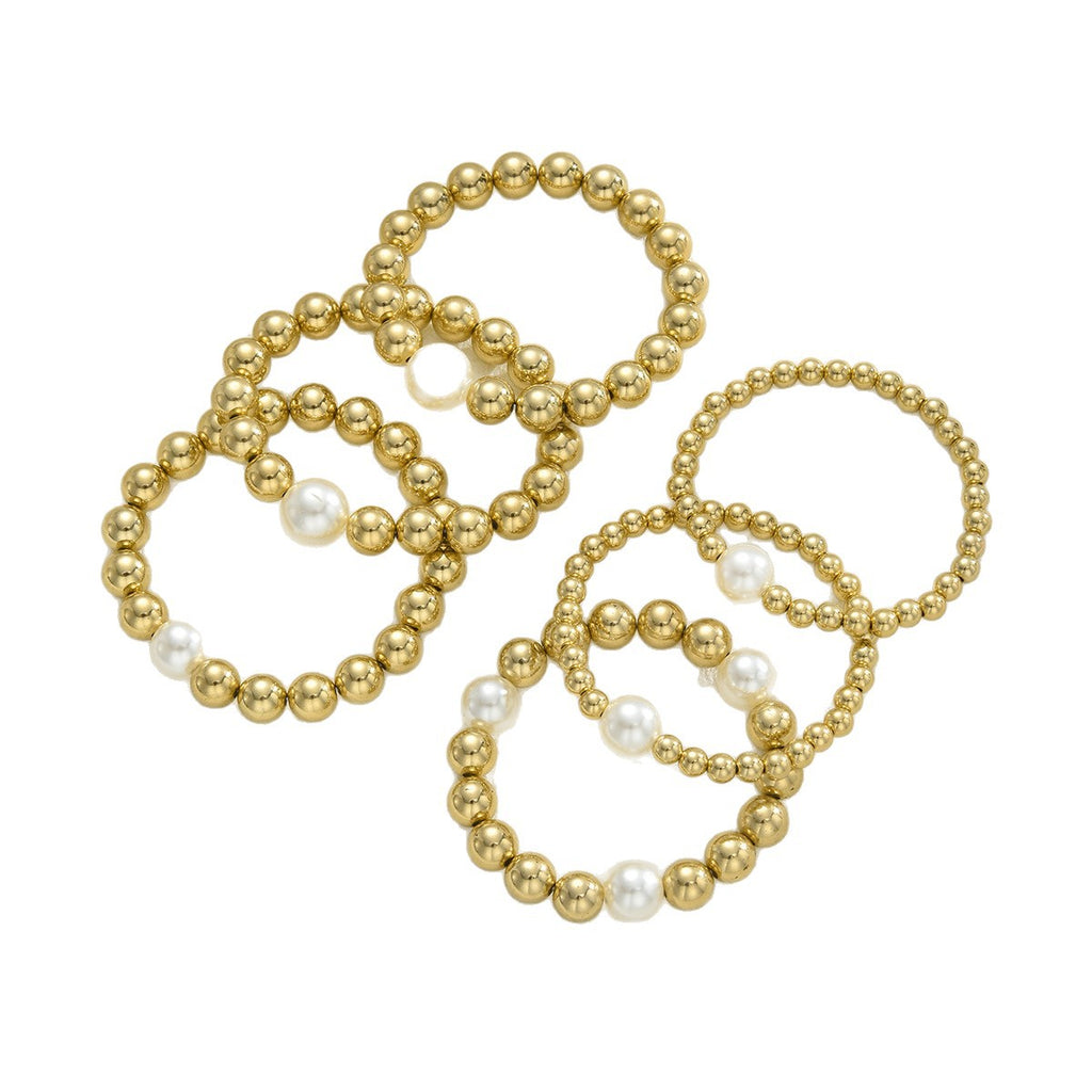 Damen Armreif-Set aus eleganten Perlen und glänzenden Goldakzenten Shop Nory