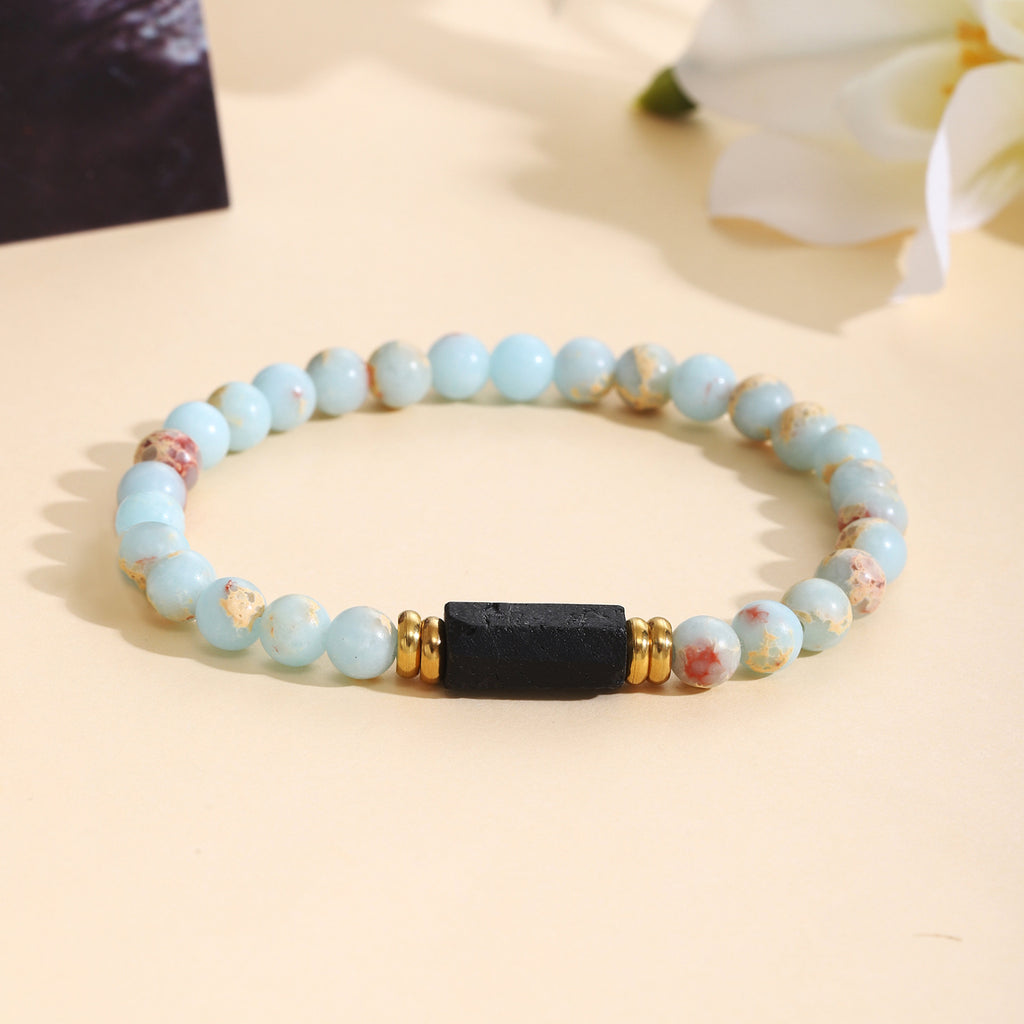 Damenarmband aus Rosenquarz mit schwarzem Akzent und goldenen Verzierungen Shop Nory