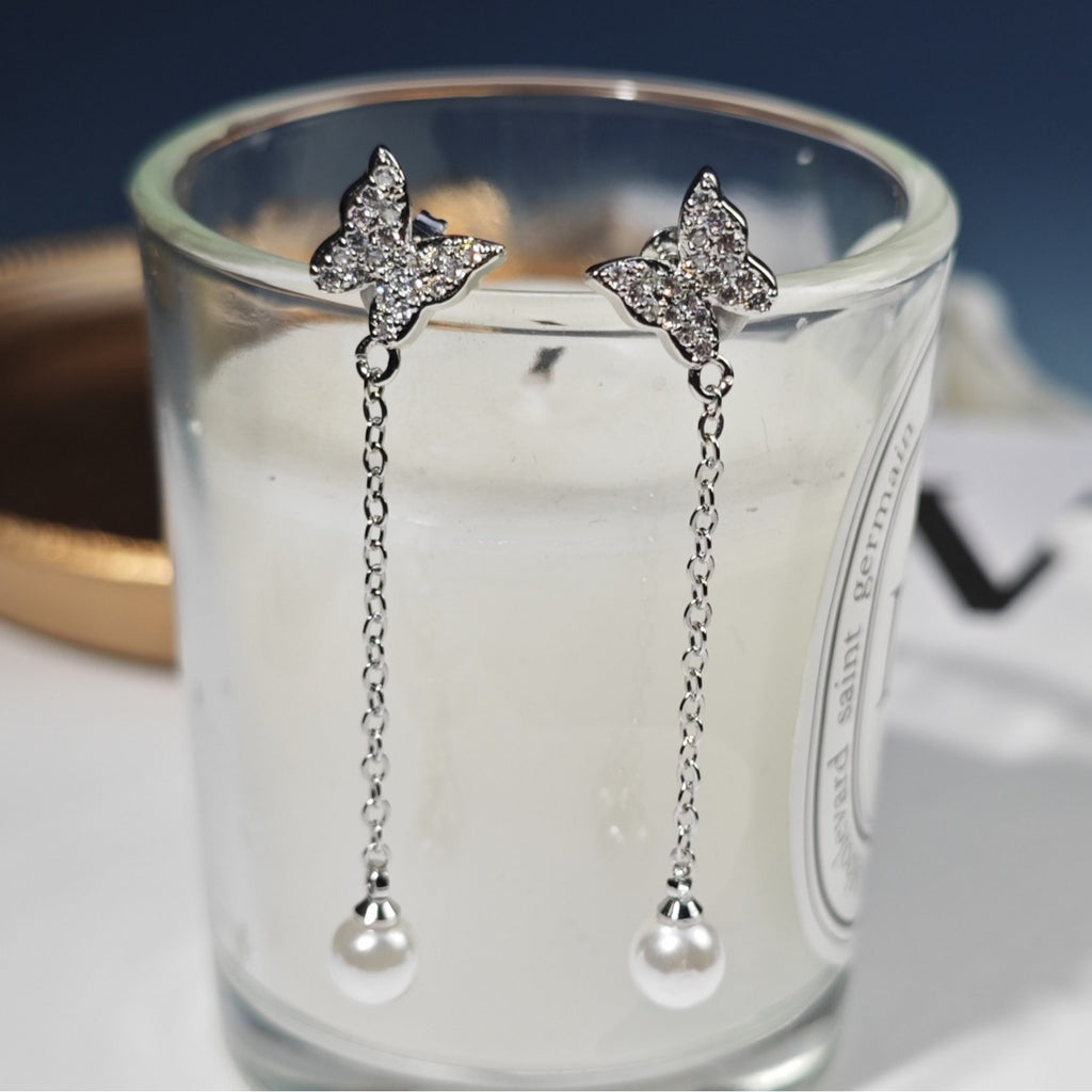 Damen Ohrringe mit Schmetterlingsdesign und Perlenanhängern Shop Nory